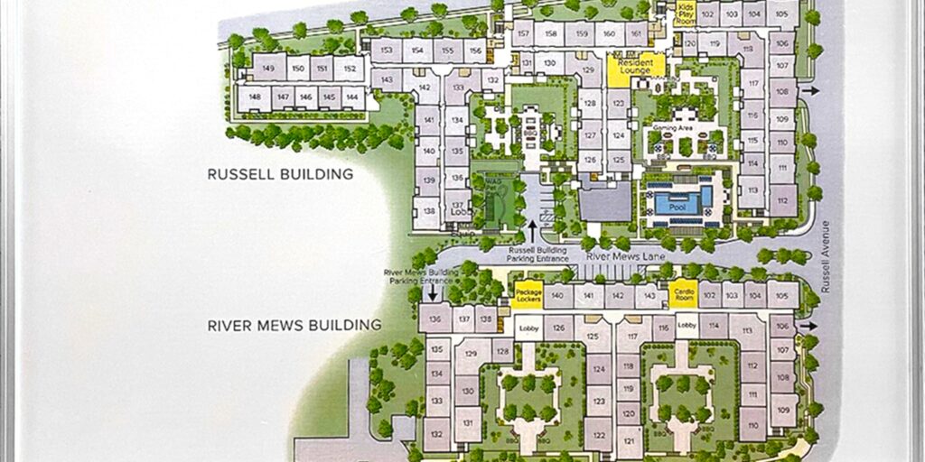 A printed site map showing labeled buildings, numbered rooms, courtyards, walkways, trees, and a small pool.